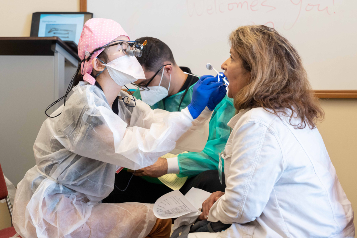 a dugoni dental student treats a patient