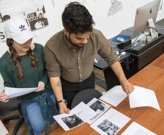 Students examining printed documents