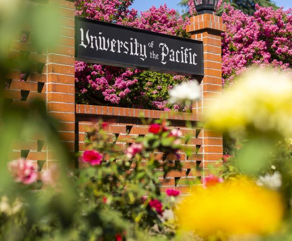 University of the Pacific sign surrounded by roses