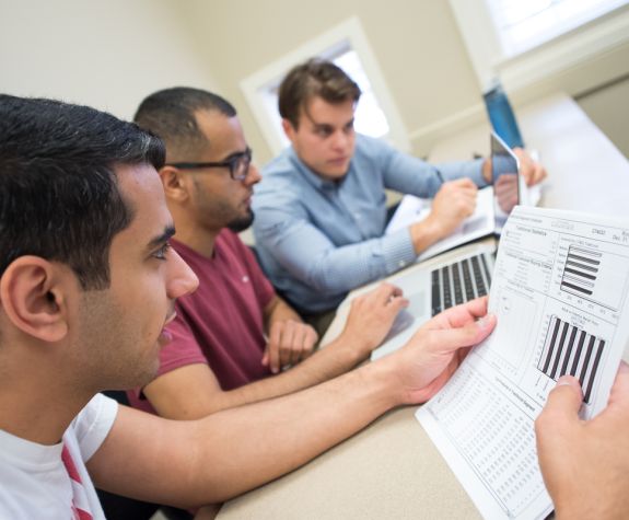 students looking through worksheets