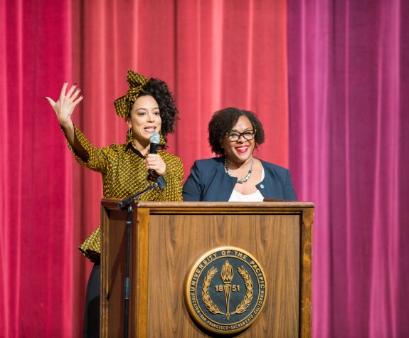 Angela Rye speaking on stage