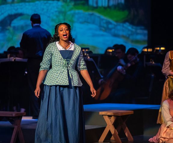 student singing on stage