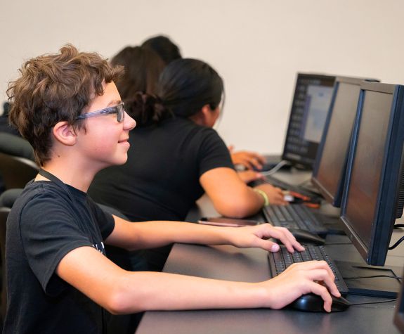 Engineering student soldering an electrical circuit