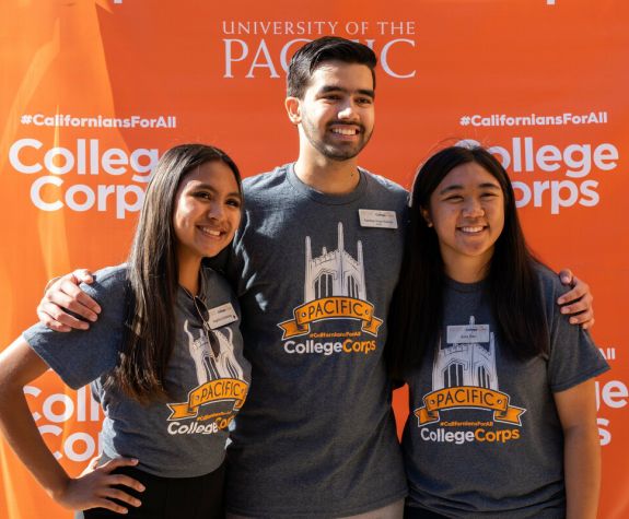 a group of Pacific students wearing College Corps shirts
