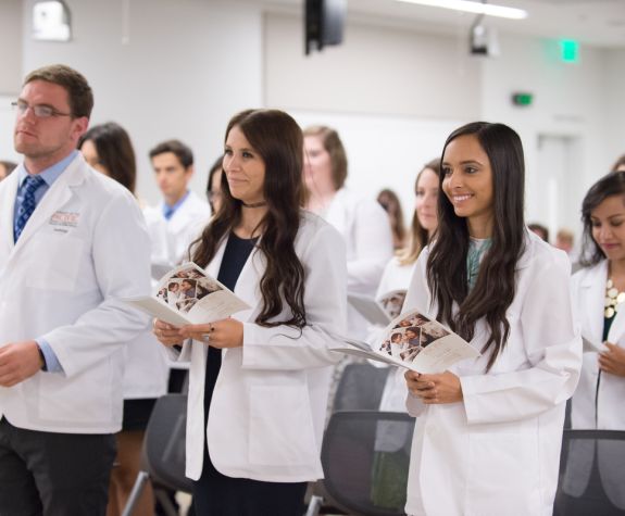 Students in white coats