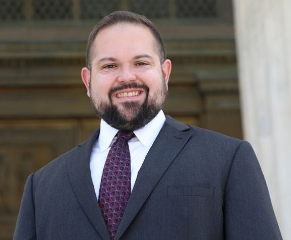 A portrait of a man in a suit