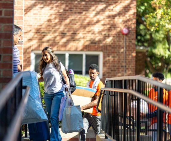 students move into a residence hall at the beginning of the semester