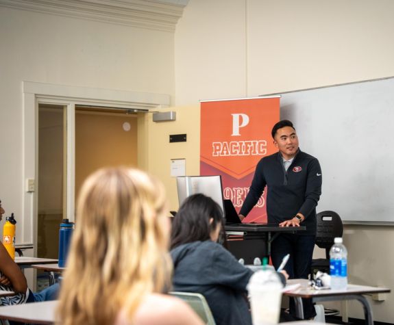 Nate Racela speaks to a class at Pacific