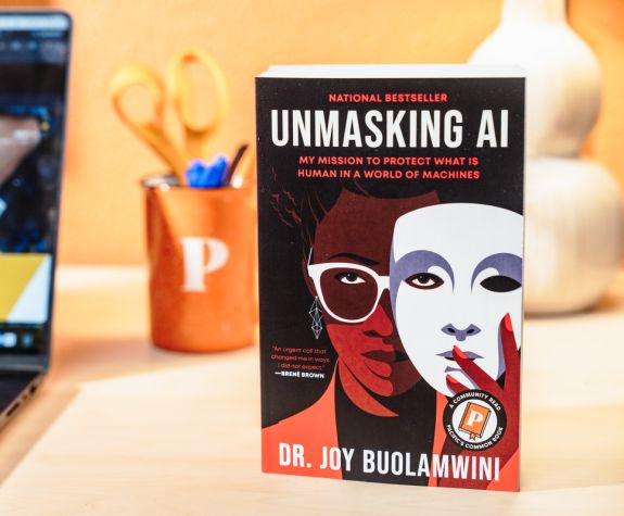 the common read book on a desk next to a laptop