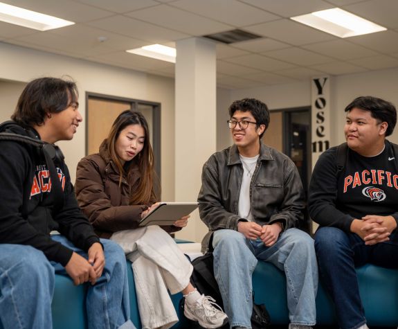 students sit together and talk