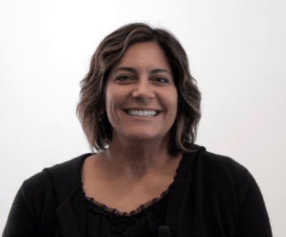 A portrait of a woman in front of a white background