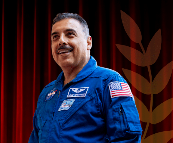 Jose Hernandez in his blue NASA jumpsuit