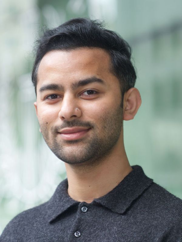 Abishay Gill is a man with black hair, wearing a dark shirt