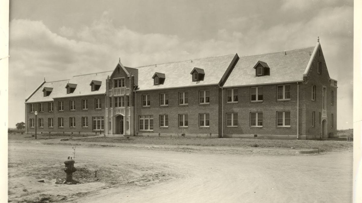 South Hall stands alone in an open field. 