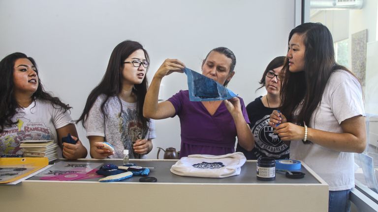 Professor demonstrating silk screen process