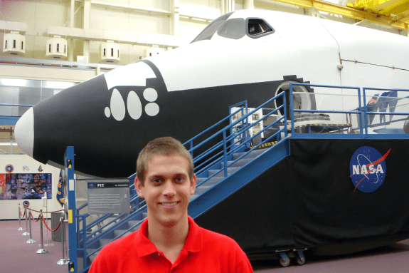 Student in from of Rocket