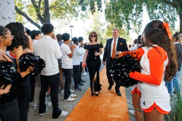 Couple walks the orange carpet into Orange & Black