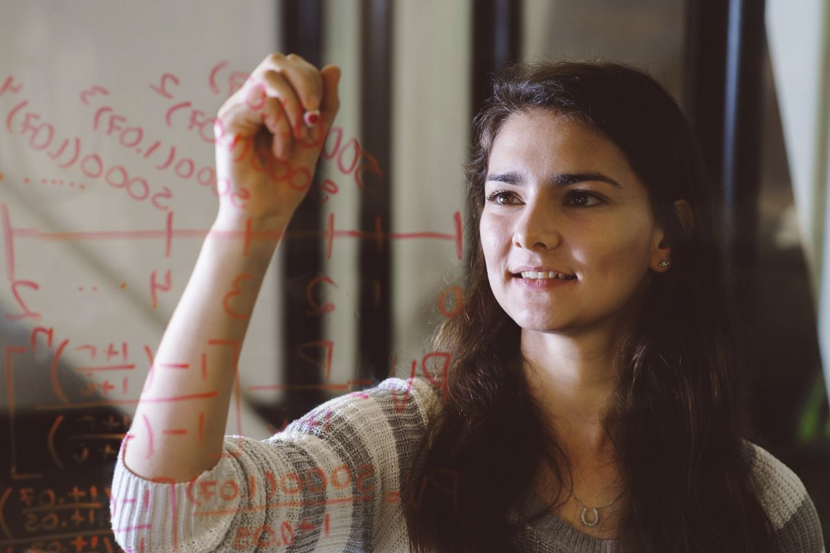 math student writing on glass