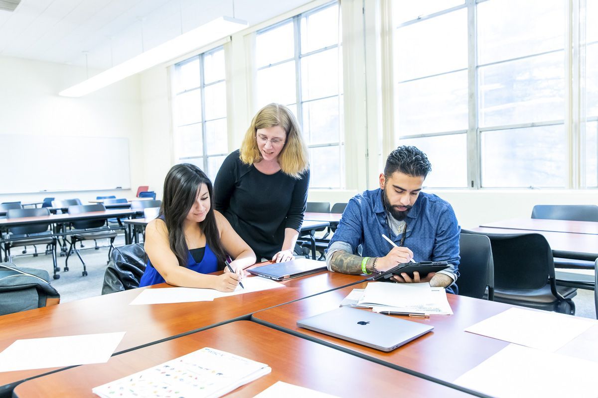 professor with students in classroom