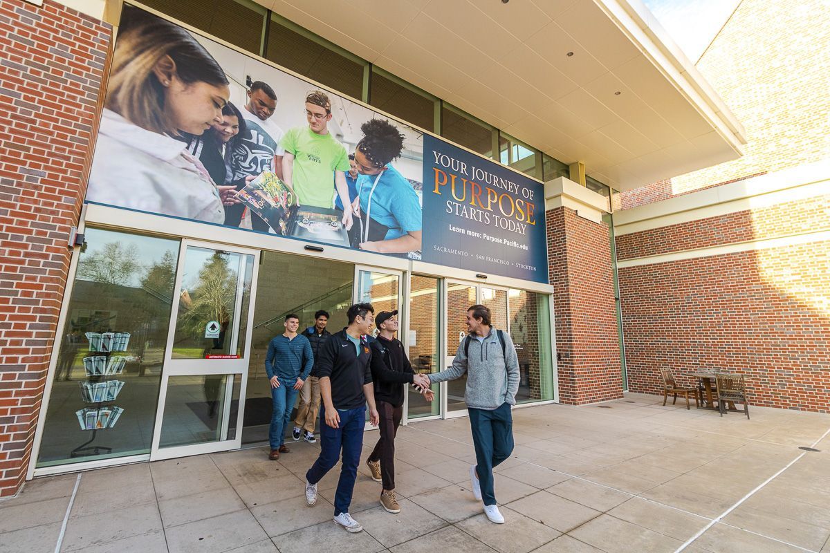 students walk outside the DUC
