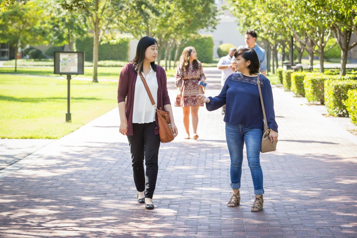 graduate students walk on campus