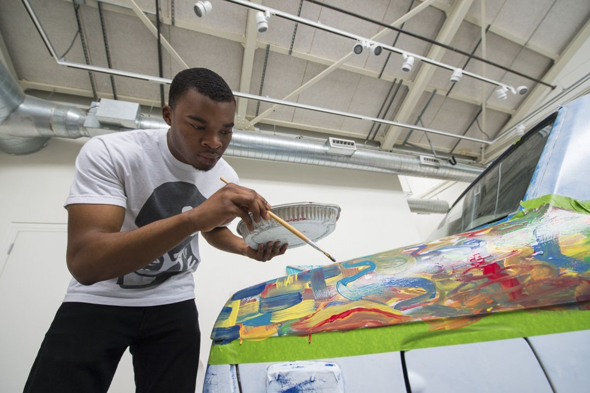 student painting art car