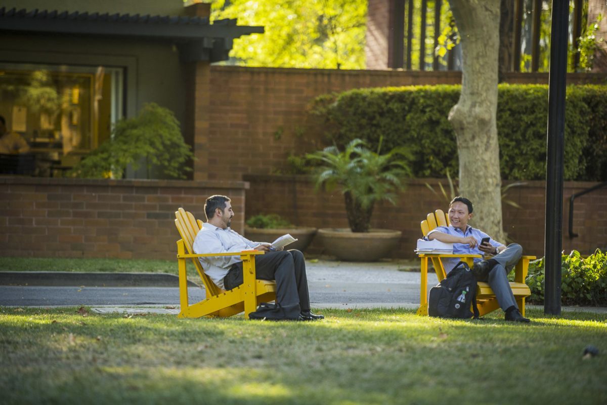 students sitting in lawn chairs