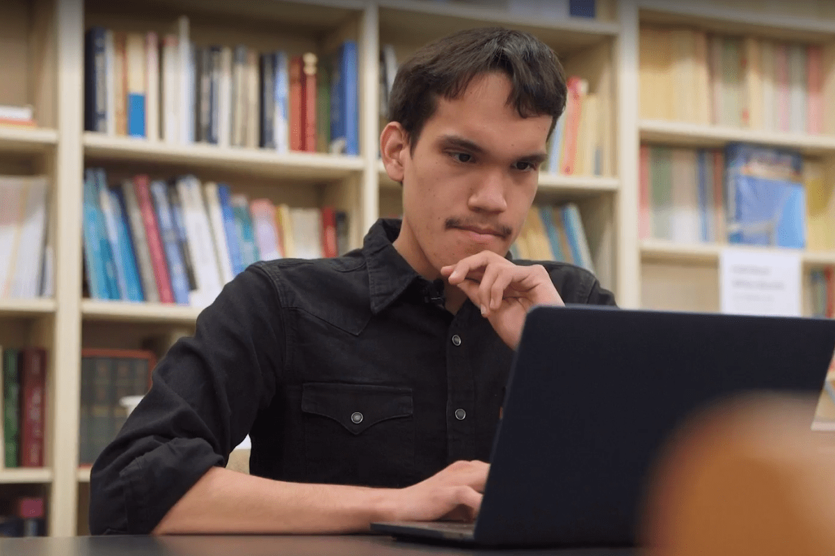 Oscar Avalos, math major, works on his laptop.