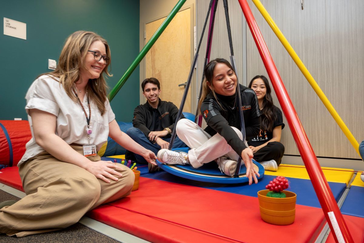 Occupational therapy students use OT tools