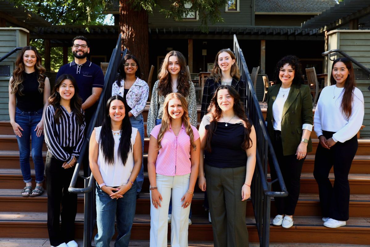 nutrition students stand on stairs