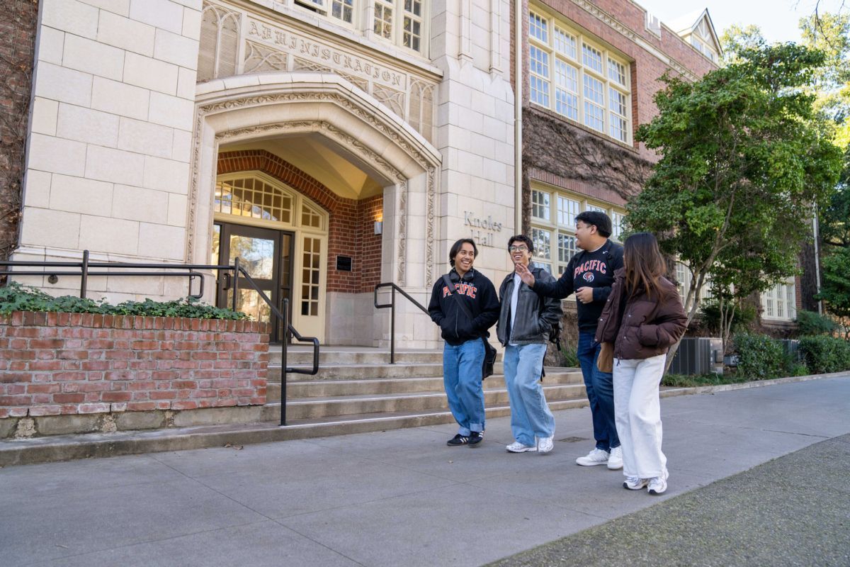 students walk near knoles hall