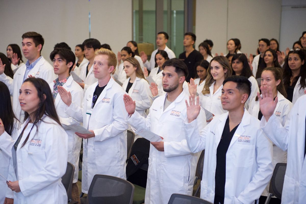 students reciting research oath