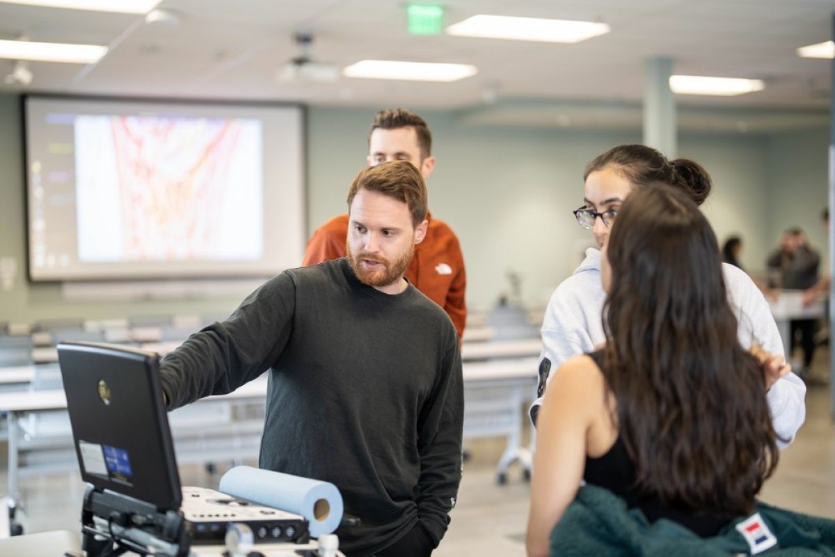 file shows students looking at a monitor. 