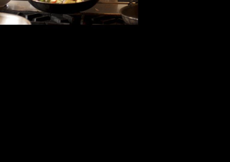 cook making stir fry