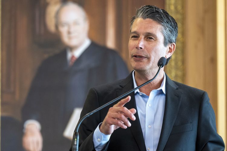 Nathan Barankin speaks at an event.