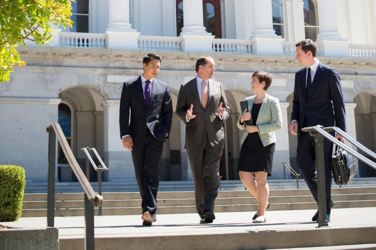 People standing in front of a building.