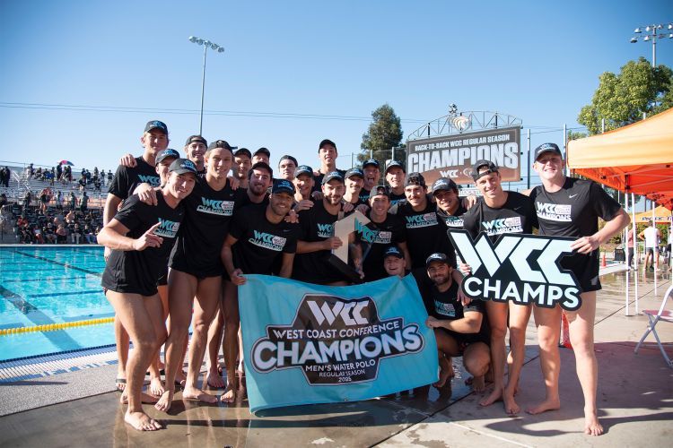 men's water polo team holds WCC championship banner