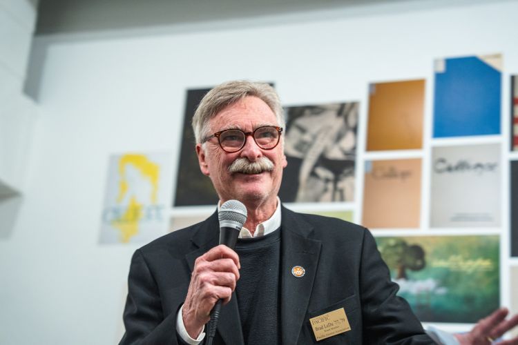 Brad Le Du ’77, ’79, member of the Alumni Association Board of Directors, speaks to attendees during the Muse: Calliope at 55 reception at the Reynolds Gallery.