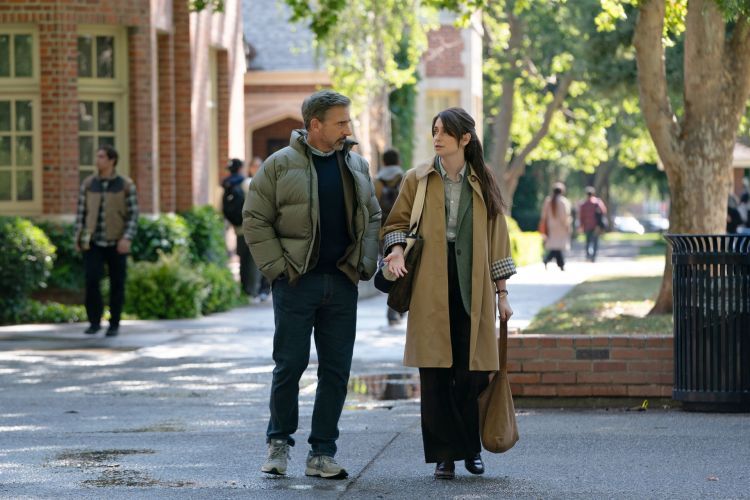 Steve Carell and Charly clive walk through campus.