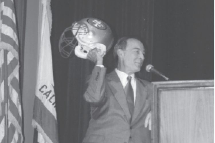 Don DeRosa holds 49ers helmet