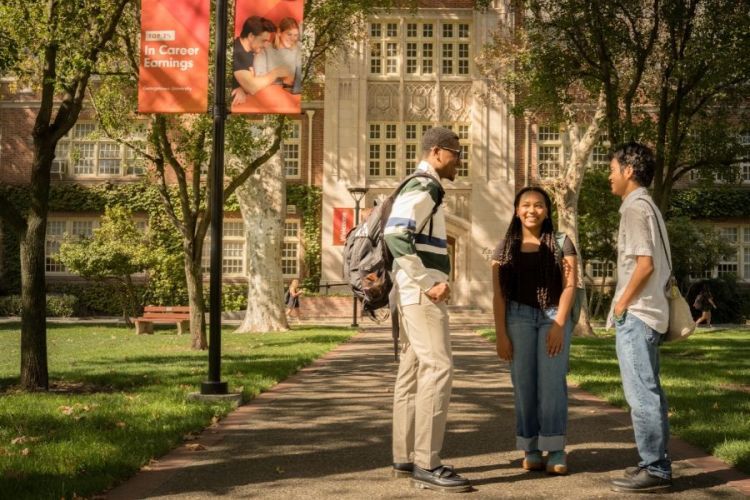 Students standing in front of Knoles Hall