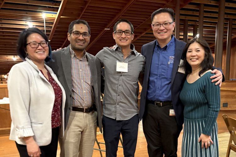 Faculty and alumni at networking mixer event