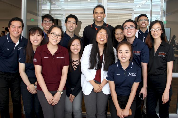 Professor Rajul Arvind Patel ’01, ’06, PharmD, PhD with students at Medicare event