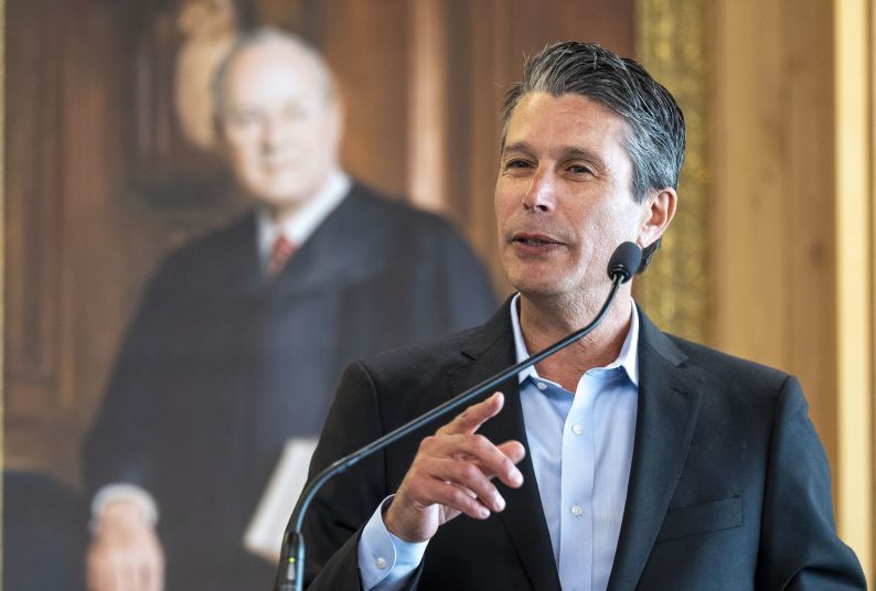 Nathan Barankin speaking at an event.