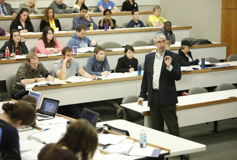 A male professor teaches a class
