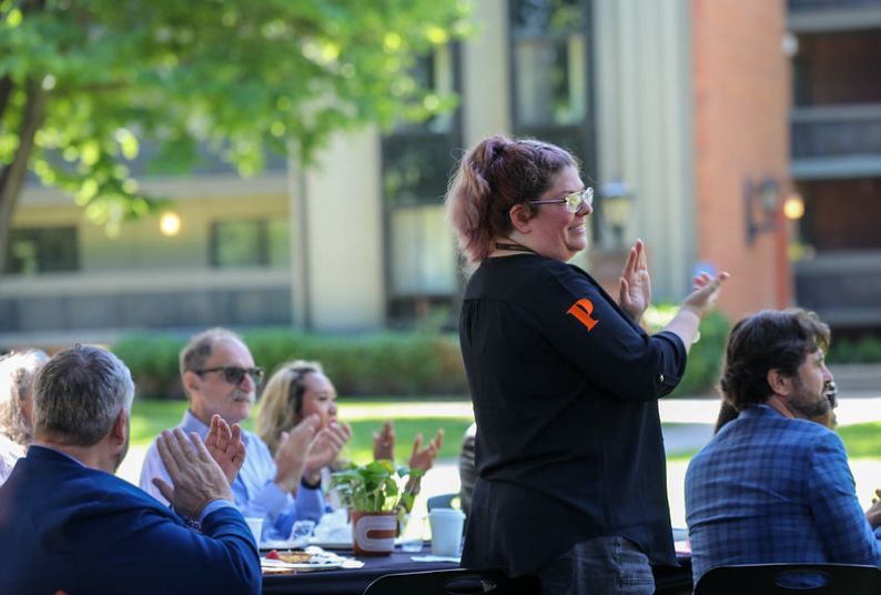 Audience applauds at Years of Service event