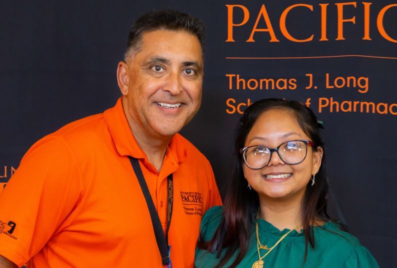 Associate Clinical Professor Rolly Kali-Rai with PharmD student