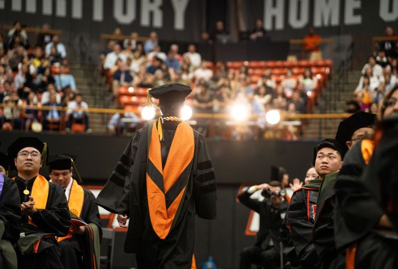 Student walking during graduation