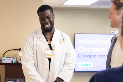 Nursing student in white lab coat