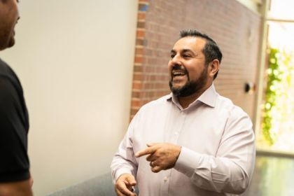 Marco Alvarado interacting with a student.